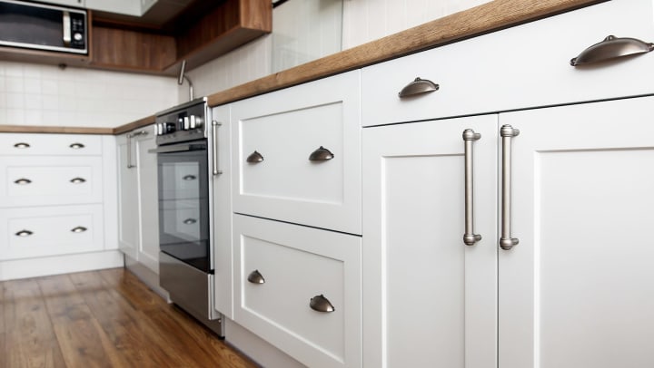 Beautiful white cabinets in a kitchen at Lux on Main