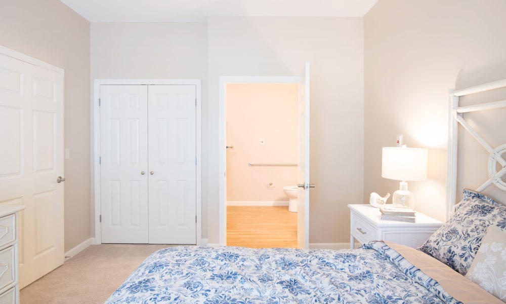 A bedroom with an attached bedroom at Keystone Place at Newbury Brook in Torrington, Connecticut