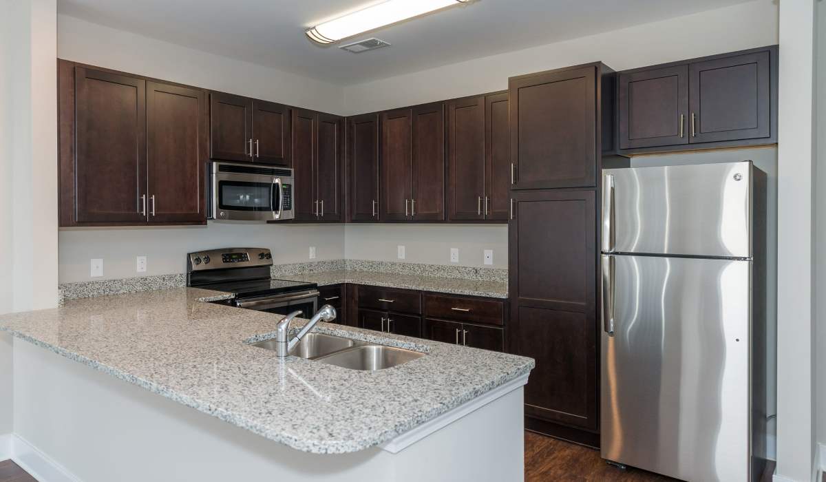 Kitchen with granite countertops at The Amber at Greenbrier, Chesapeake, Virginia