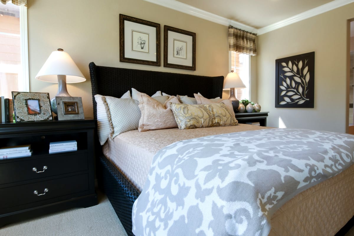 A decorated apartment bedroom at Rosewood Estates in Cobourg, Ontario