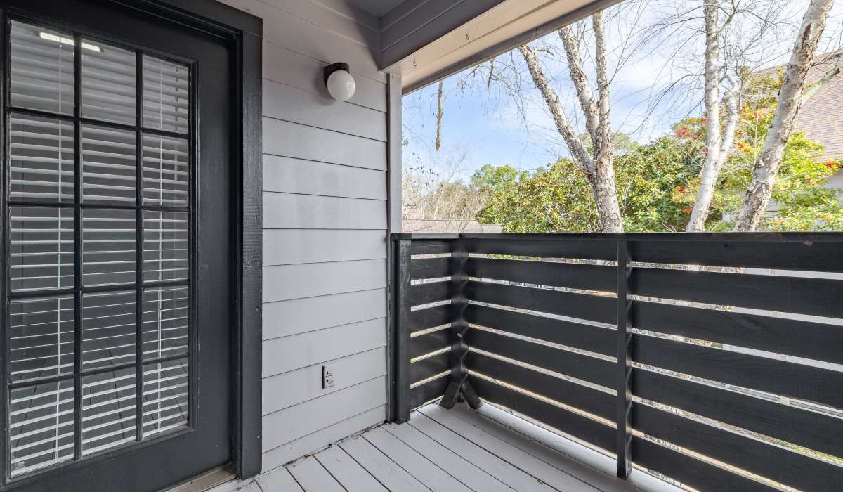 Private patio balcony at Oaks of Kingwood Apartments in Kingwood, Texas