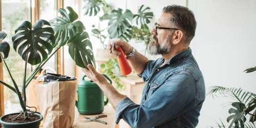 Resident watering his plants at Mountain Breeze Villas in San Bernardino, California