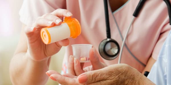 Caretaker administrating medication at Montello Care Center in Montello, Wisconsin