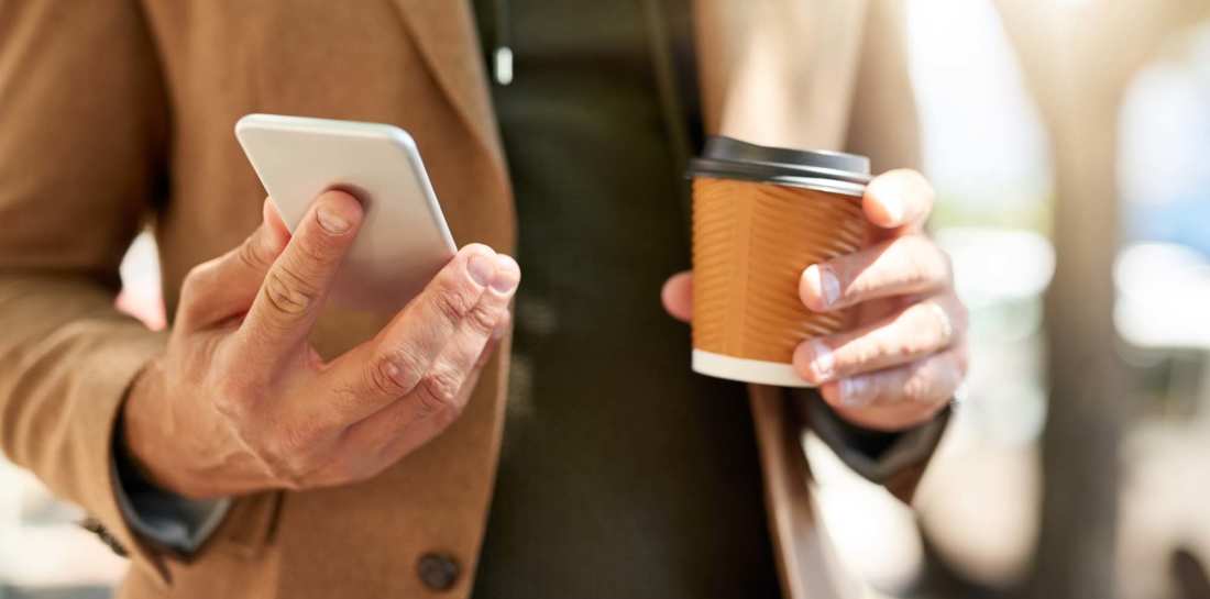 Resident using phone at Willow Creek Townhomes in Jonesboro, Arkansas