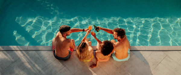 Residents hanging out by the pool at Woodstream Townhomes in Rocklin, California