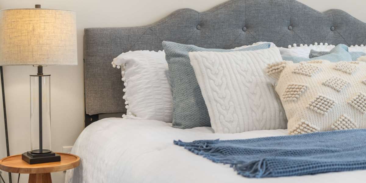 Bed with decorative pillows and lamp at Yardley Hills I in Prince Frederick, Maryland 