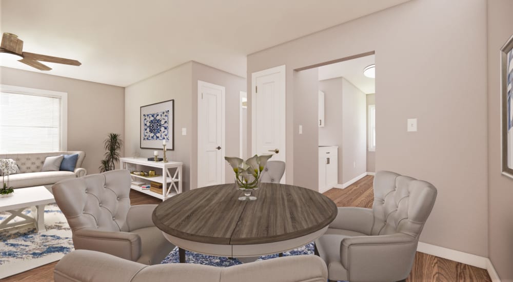 A render of a dining room table and living room with ceiling fan at The Lyle in Fort Walton Beach, Florida
