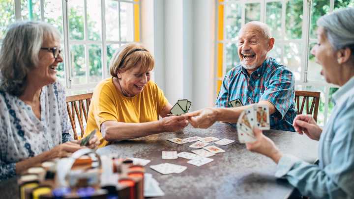 Residents happily playing cards