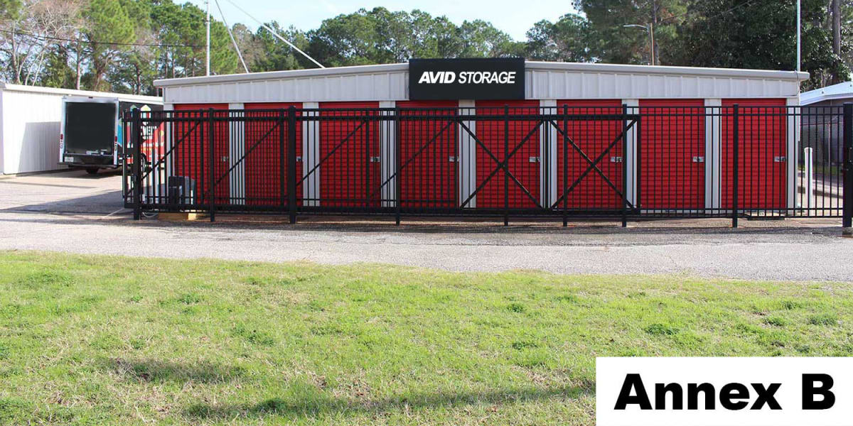 Self storage units behind an electronic gate at Avid Storage in Navarre, Florida