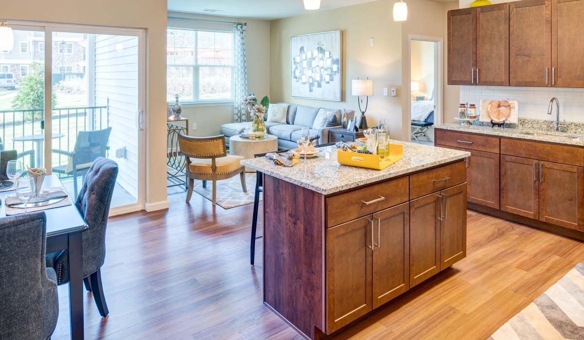 Living room with attached patio and window at One Glastonbury Place in Glastonbury, Connecticut