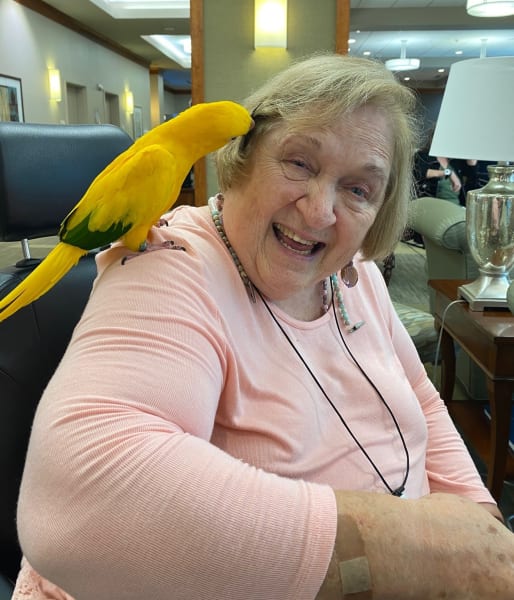 One Woodstock resident shows her biggest smile as she enjoys the exotic bird show!