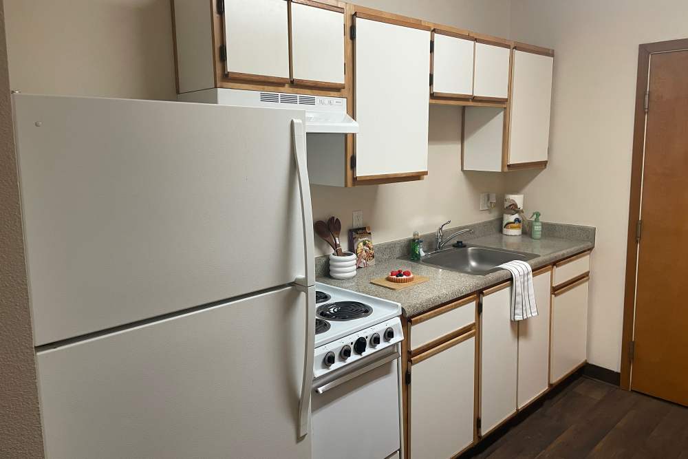 Kitchen with white appliances at The Yards At Union Station in Portland, Oregon