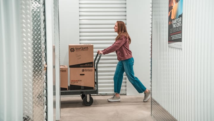 Woman pushing storage boxes