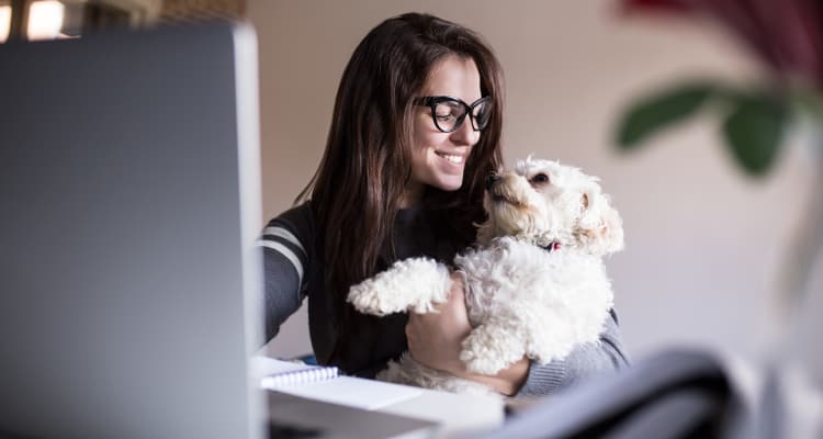 Resident and her dog loving their new home at The Landing at Mansfield in Mansfield, Texas