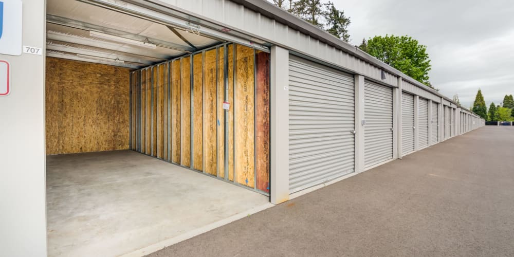 Drive-up storage units, the nearest with an open door, at Trojan Storage of Bend in Bend, Oregon