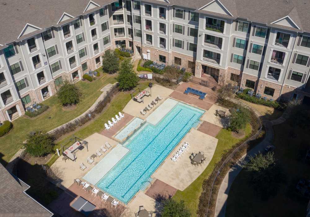 Apartment community swimming aerial view at Nantucket at Fannin Station in Houston, Texas