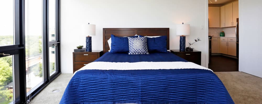 Very cozy bed with amazing views out of the large windows in the bedroom at The Main in Evanston, Illinois