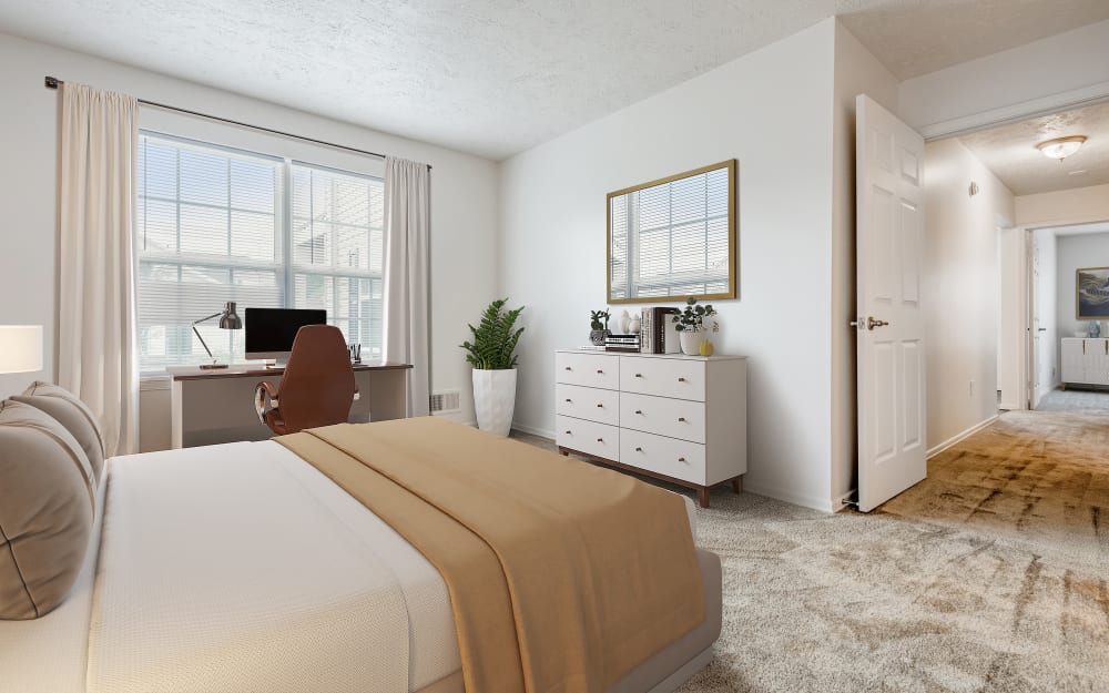 Model bedroom with wall to wall carpeting at Westview Commons Apartments in Rochester, New York