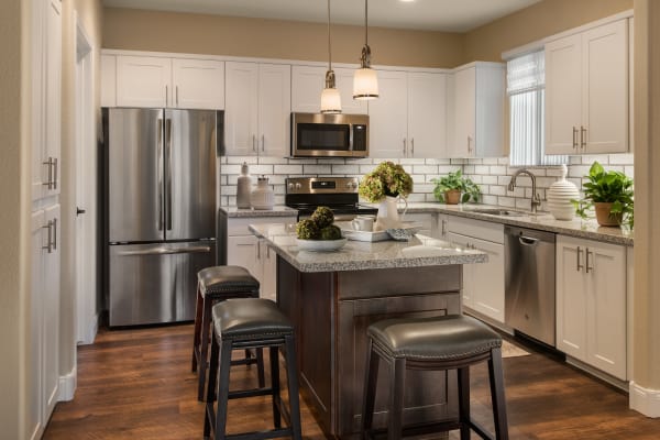 Gourmet kitchen with granite countertops and stainless-steel appliances at San Piedra in Mesa, Arizona