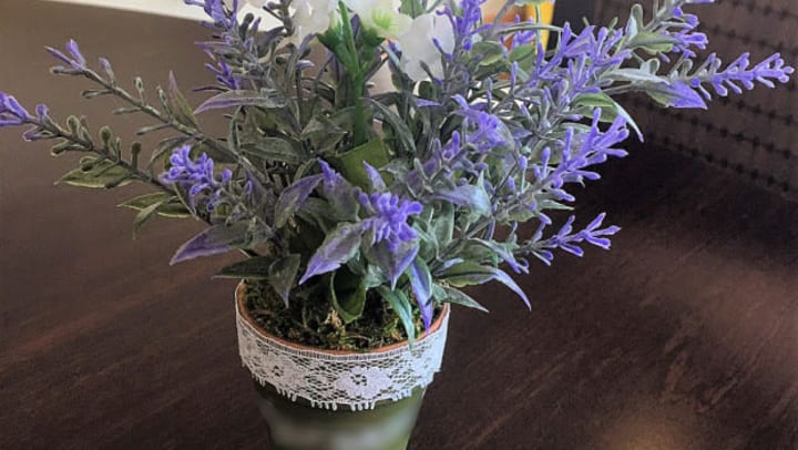 flower pot with a purple plant