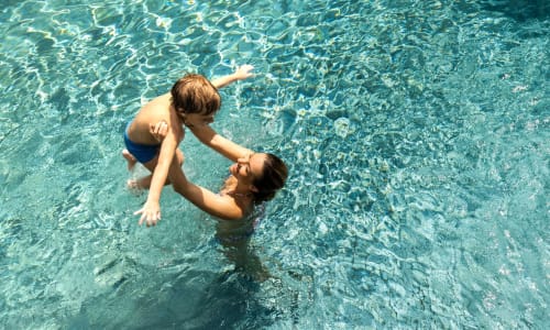 Family playing in the pool at Adelaide Pines in Concord, California