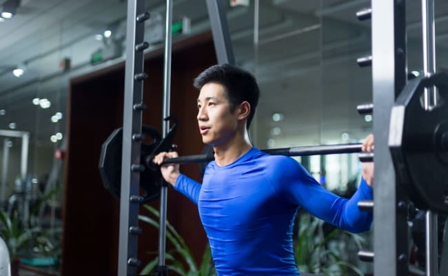 Resident working out at the gym at Enclave at North Point Apartment Homes in Winston Salem, North Carolina
