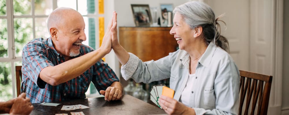 Two residents playing a card game together at Burton Health Care Center in Burton, Ohio