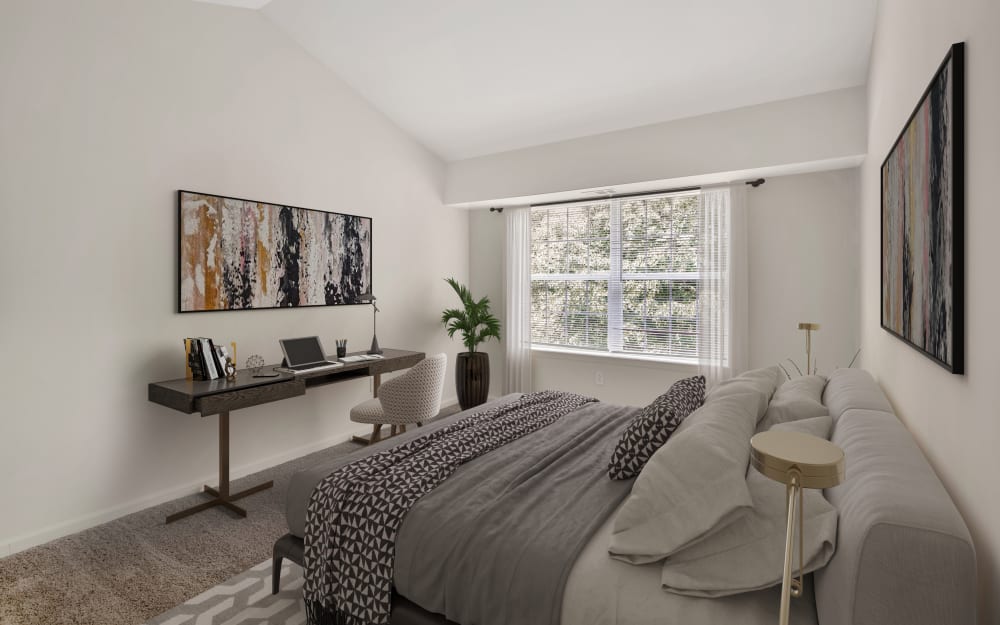 Model bedroom with ensuite bathroom and closet at Abrams Run Apartment Homes in King of Prussia, Pennsylvania