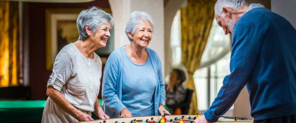 Residents playing foosball at Lake Forest at Swift Creek in Midlothian, Virginia
