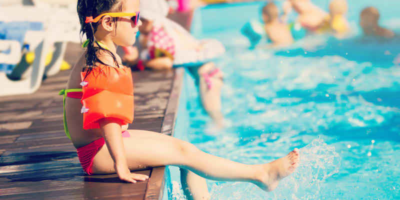 a young girl playing in the swimming pool at Miramar Milcon in San Diego, California