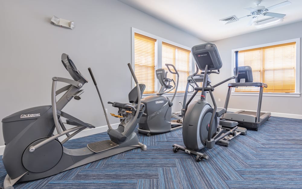 Well-equipped fitness center with cardio equipment at North Ponds Apartments & Townhomes in Webster, New York