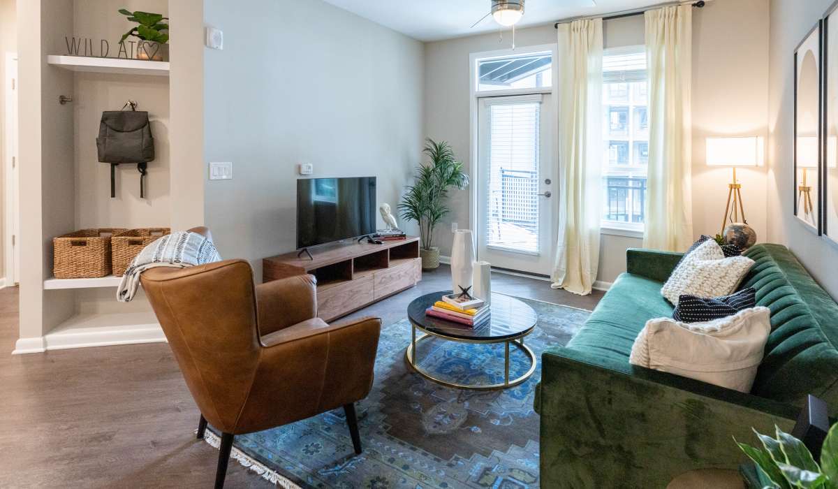 Model living space with carpet The Jade at Avondale in Decatur, Georgia