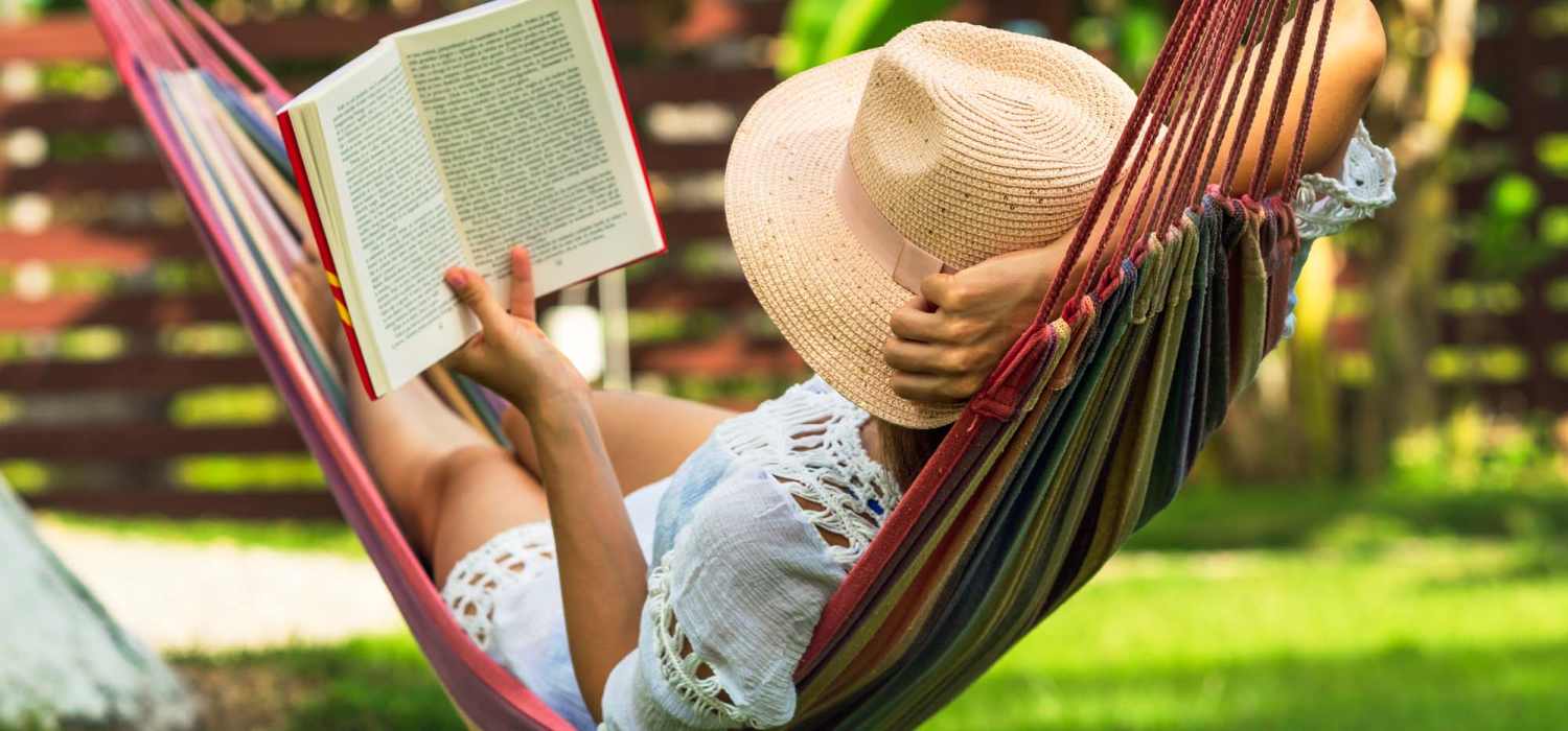 Resident reading book in a hammock at Stonegate Square in Midlothian, Texas