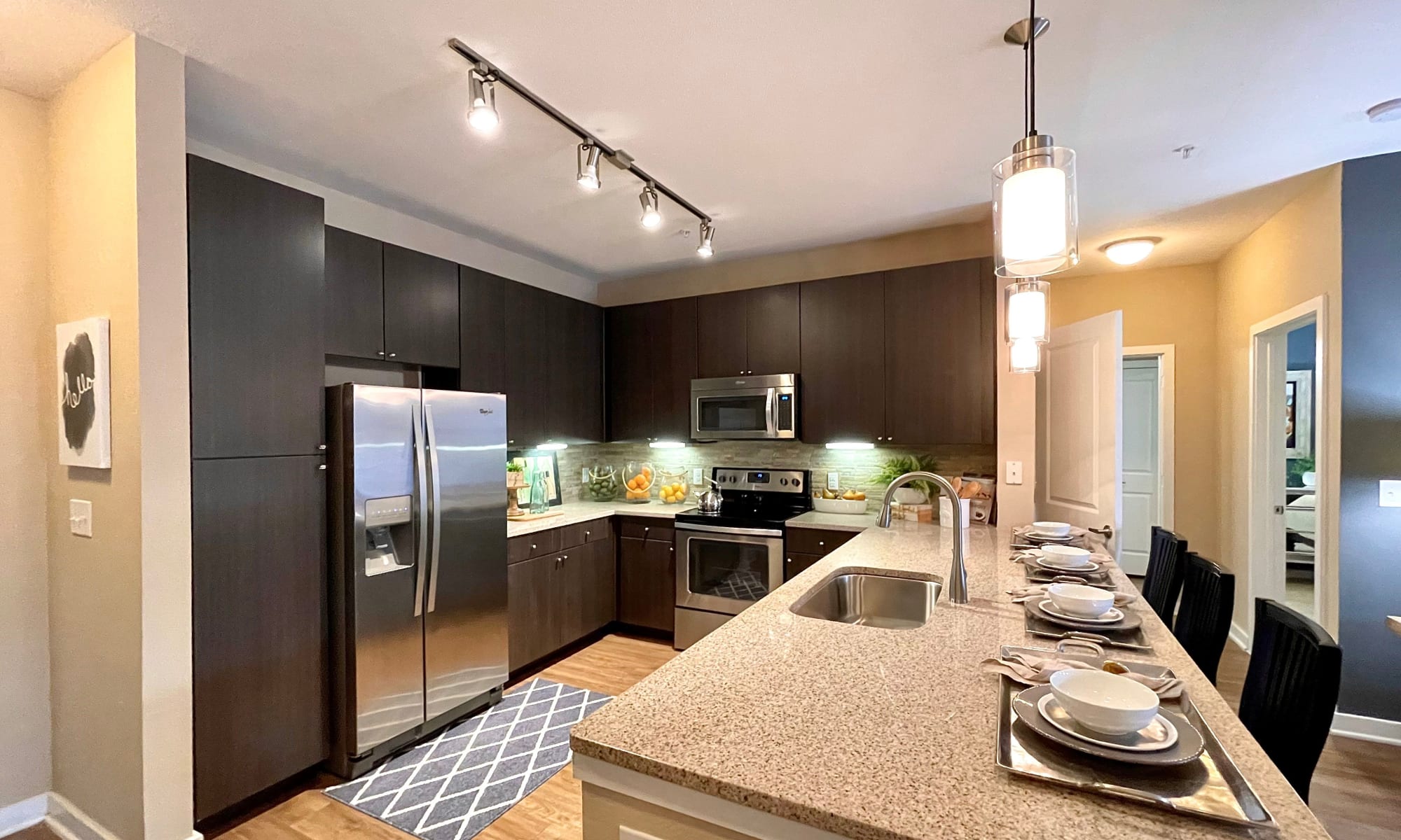 Modern and upscale kitchen in an apartment at The Abbey at Spring Town Center in Spring, Texas