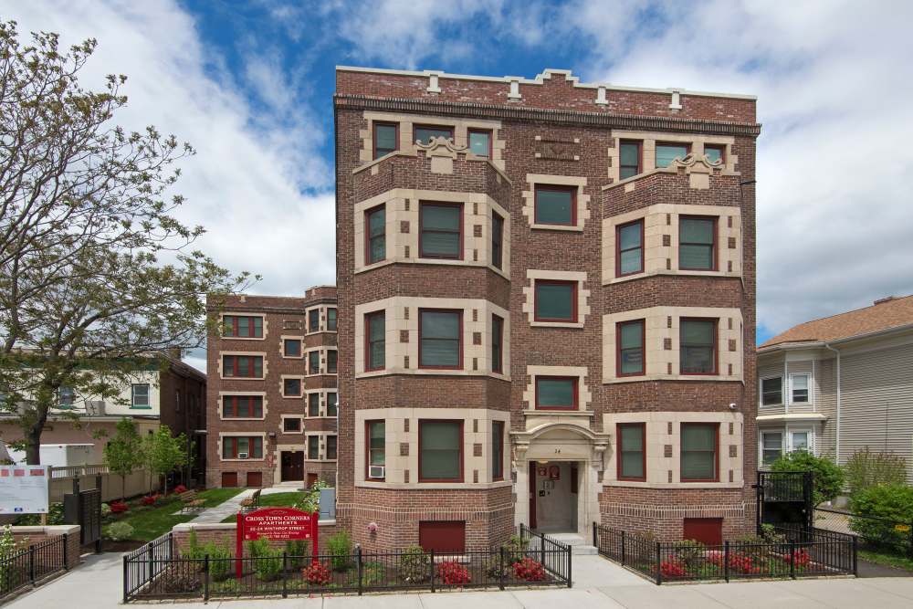 Apartment building with garden area at Cross Town Corners in Springfield, Massachusetts