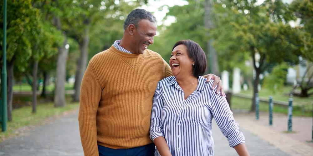 A resident couple walking near Careage at Home in Bellevue, Washington. 