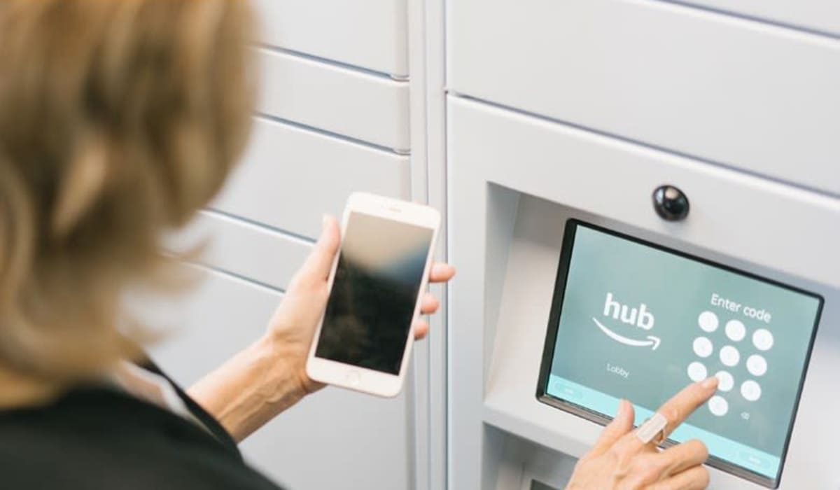 Resident using hub screen at The Mark | Fairfield County in Shelton, Connecticut