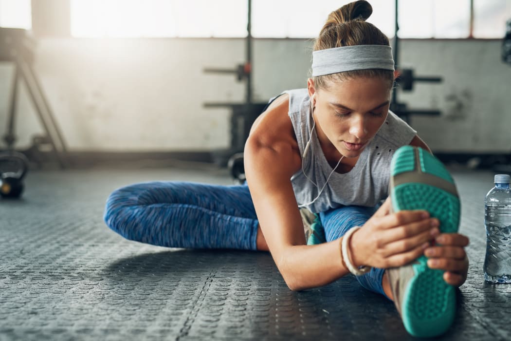 Woman stretching at Tuscany Hills at Nickel Creek's fitness center in Tulsa, Oklahoma