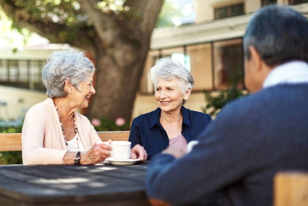 Residents enjoying a coffee in a outdoor area of Hollenbeck Terrace in Los Angeles, California