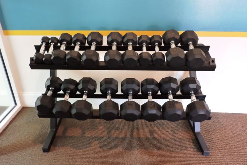 Rack of weights in the fitness center at Artistry at Bethesda Park in Lawrenceville, Georgia