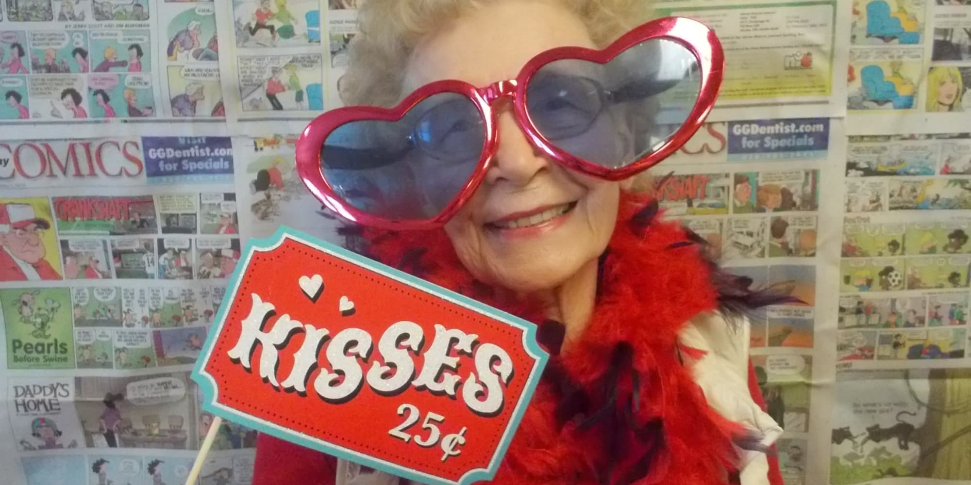 A resident holding a sign at Estrella Estates Gracious Retirement Living in Goodyear, Arizona