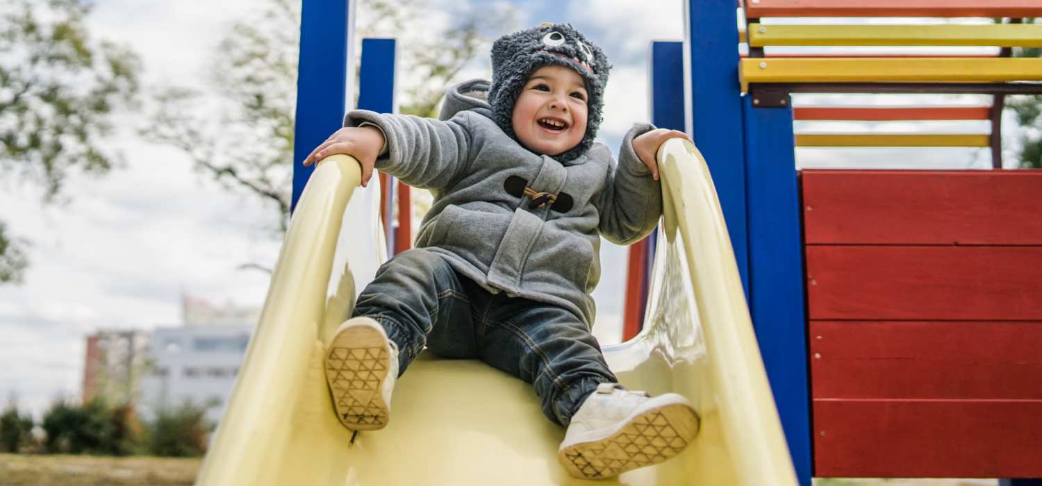 Kids playground with a slide near Franklin Pointe in Reed City, Michigan