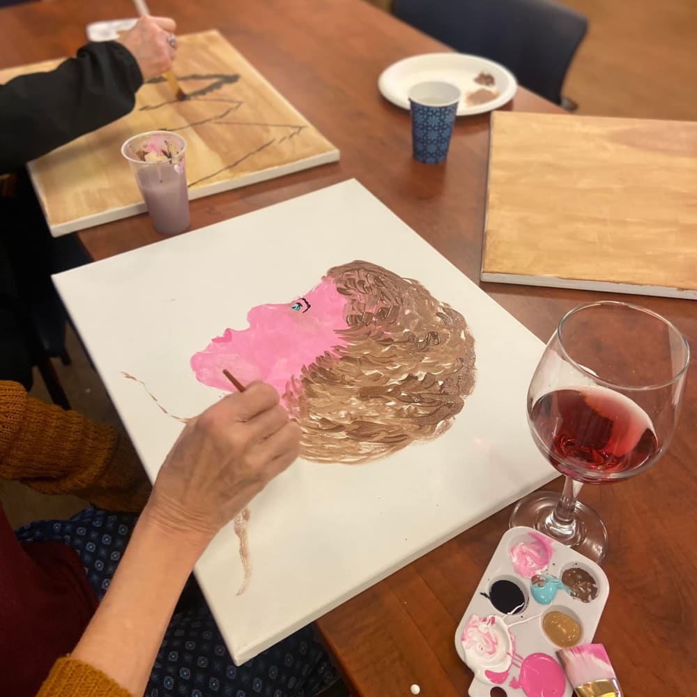 Caretakers helping with arts and crafts at Carolina Gardens at York in York, South Carolina