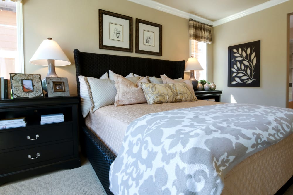 A large decorated bedroom at The Arbours at Linden Pointe in Winnipeg, Manitoba