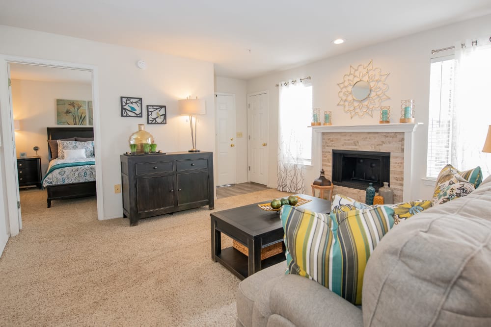 Bright living room with fireplace at Crown Pointe Apartments in Oklahoma City, Oklahoma