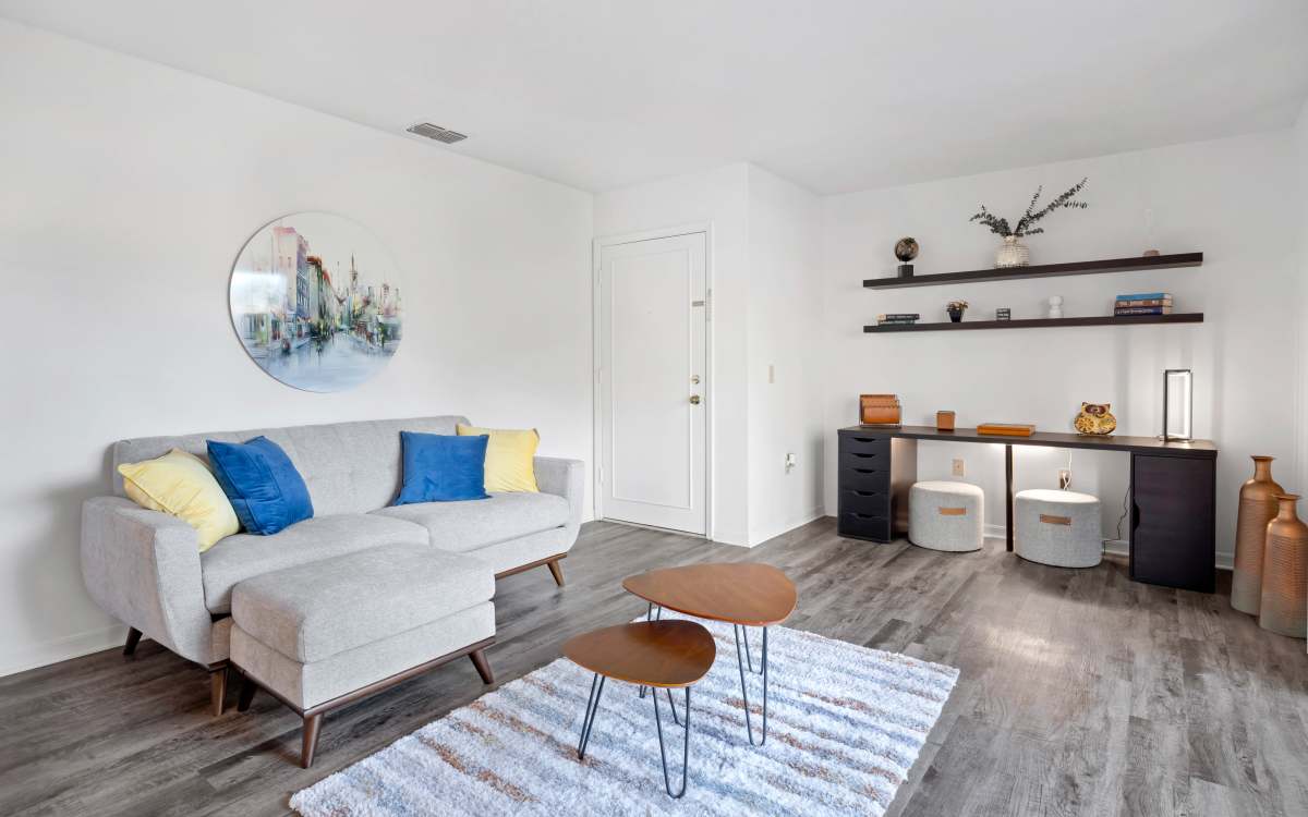 Spacious living room with couche, coffee table at Carlton Arms Of Magnolia Valley in New Port Richey, Florida