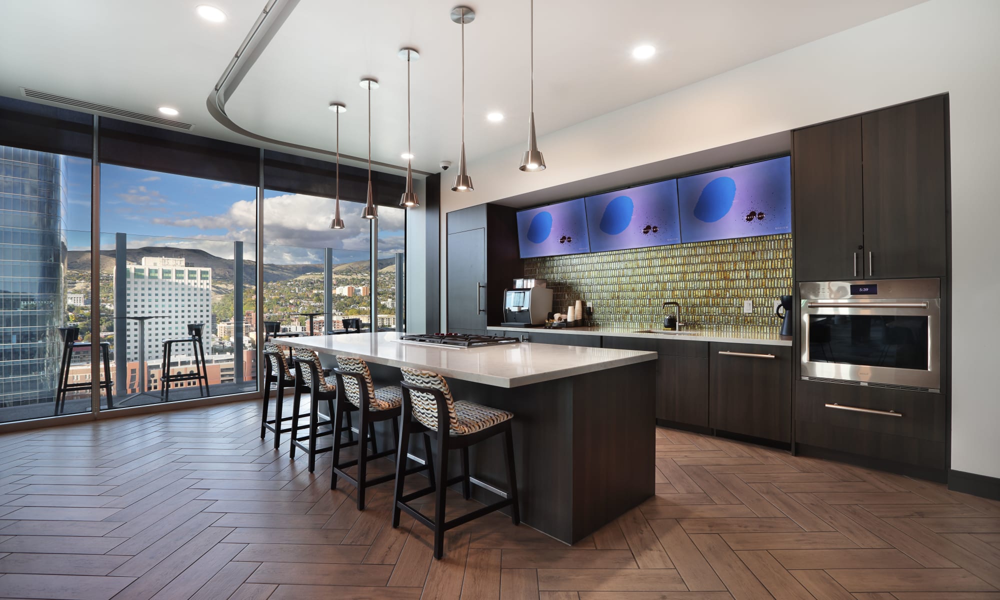 Rooftop clubroom kitchen with island and barstools at Luxury high-rise community of Liberty SKY in Salt Lake City, Utah
