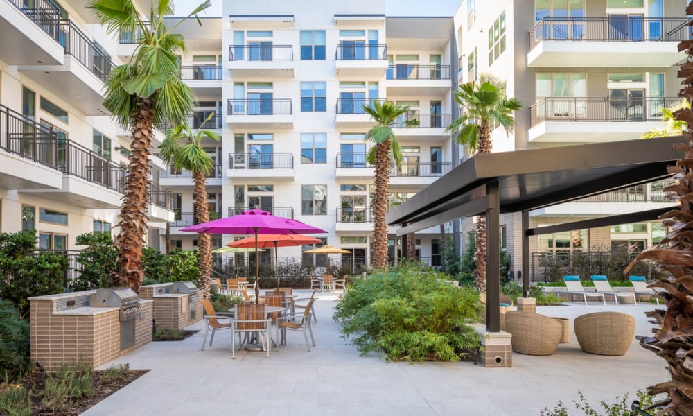 Patio seating by the pool at Bellrock Summer Street in Houston, Texas