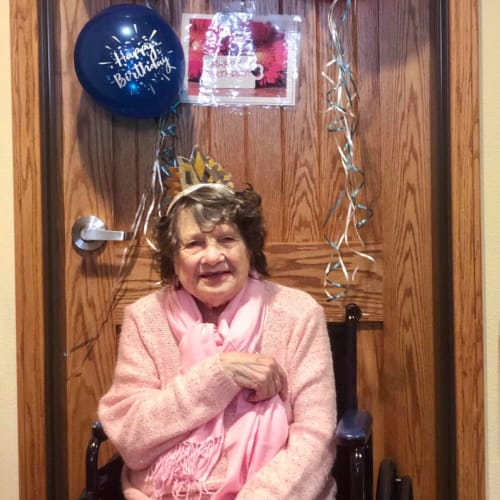 Resident celebrating her birthday at Oxford Glen Memory Care at Sachse in Sachse, Texas