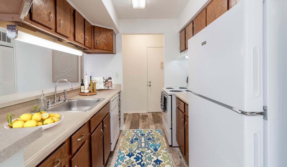 Kitchen with appliances at Tanglewood Apartments in Southern Pines, North Carolina